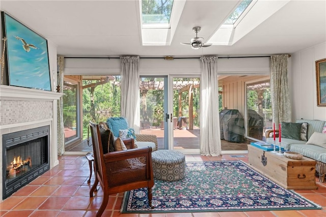 105 Driftwood Pl, Saint Simons Island, GA 31522 - tiled living area featuring a skylight and a fireplace