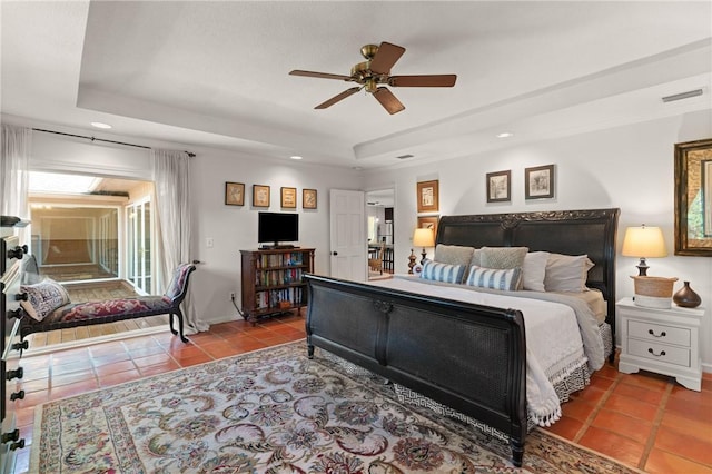 105 Driftwood Pl, Saint Simons Island, GA 31522 - bedroom with a raised ceiling, tile patterned floors, recessed lighting, and ceiling fan