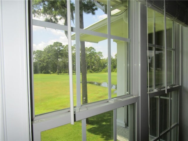 unfurnished sunroom featuring a water view