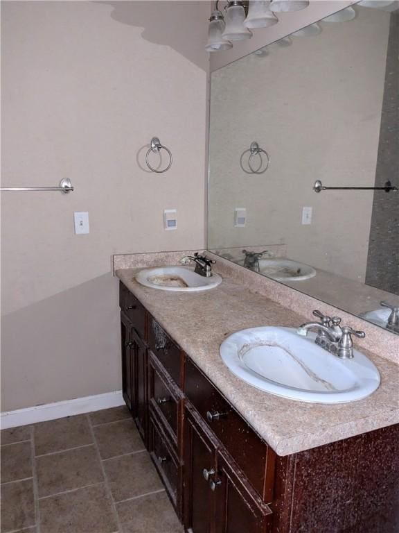 bathroom with tile patterned flooring and vanity