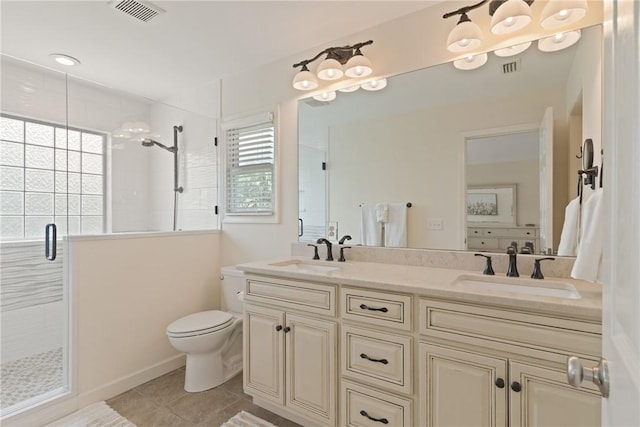 630 Sheraton Plz, Saint Simons Island, GA 31522 - bathroom with a shower stall, double vanity, and tile patterned flooring