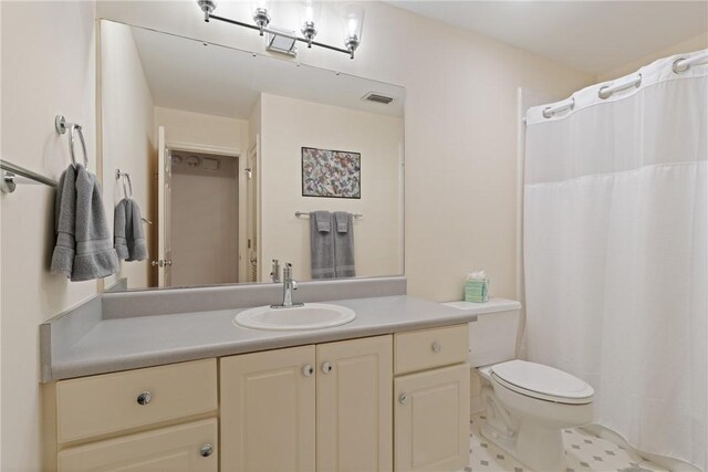 630 Sheraton Plz, Saint Simons Island, GA 31522 - bathroom with vanity, curtained shower, and tile patterned floors