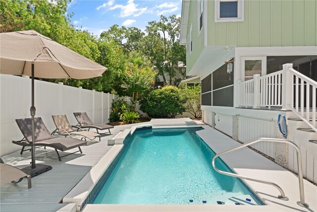 630 Sheraton Plz, Saint Simons Island, GA 31522 - view of swimming pool with a fenced backyard, a sunroom, and a deck