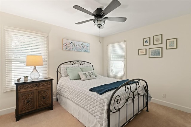 630 Sheraton Plz, Saint Simons Island, GA 31522 - carpeted bedroom featuring baseboards and ceiling fan