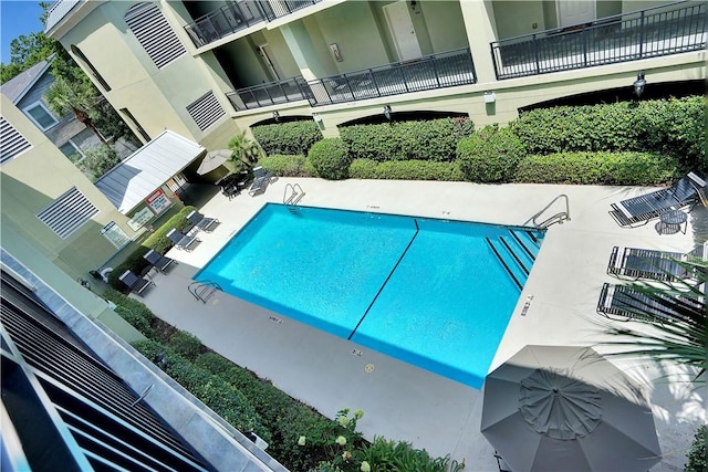 community pool with a patio area