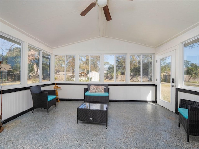 sunroom with ceiling fan, plenty of natural light, vaulted ceiling, and radiator heating unit