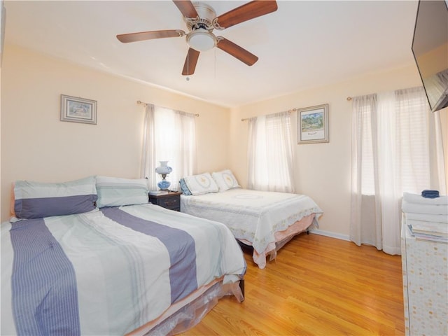 bedroom featuring ceiling fan and light hardwood / wood-style floors