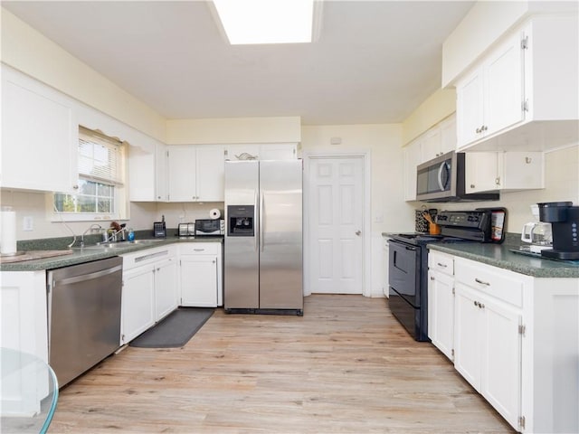 kitchen featuring light hardwood / wood-style floors, sink, white cabinetry, and stainless steel appliances