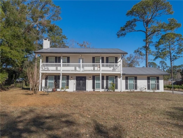 view of front of house with french doors and a front yard