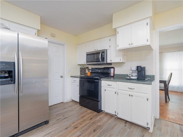 kitchen featuring white cabinetry, stainless steel appliances, and light hardwood / wood-style floors