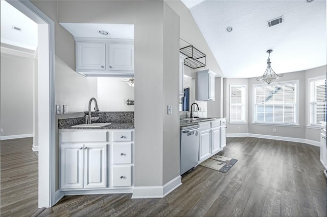 kitchen with a sink, dark wood-style floors, and dishwasher