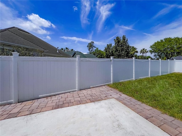 view of patio featuring fence