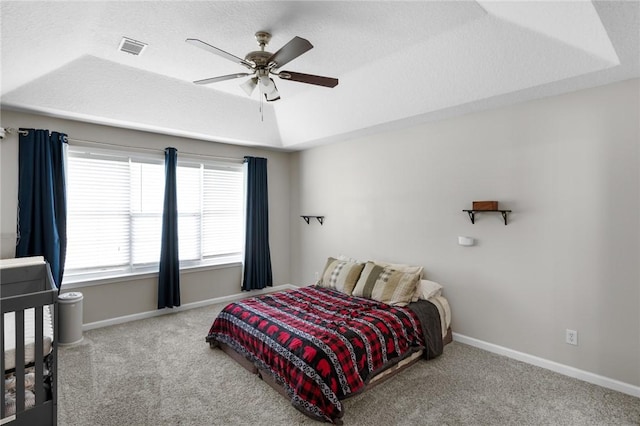 bedroom featuring carpet floors, baseboards, visible vents, and ceiling fan