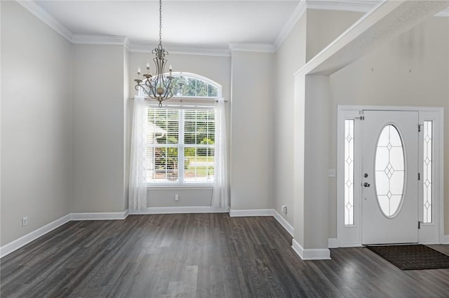 entryway featuring an inviting chandelier, baseboards, crown molding, and dark wood-style floors