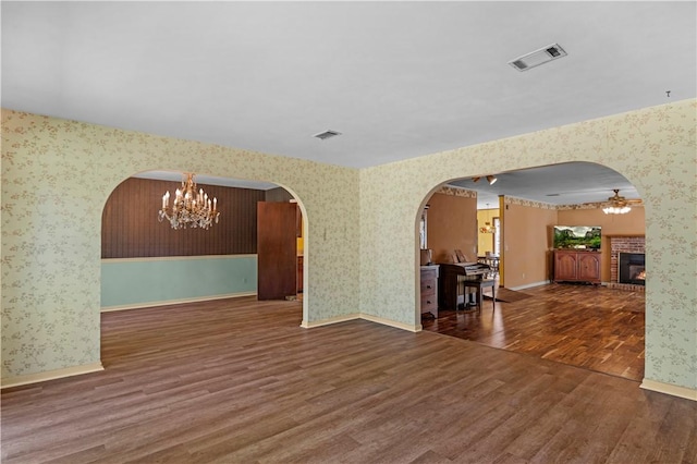 208 Plantation Dr, Waycross, GA 31501 - interior space with arched walkways, wallpapered walls, and visible vents