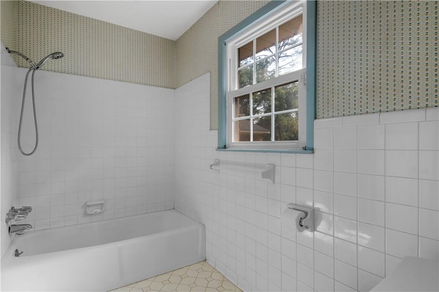 208 Plantation Dr, Waycross, GA 31501 - bathroom with tile walls, tile patterned flooring, wainscoting, and bathing tub / shower combination