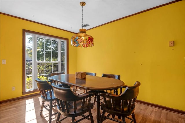 208 Plantation Dr, Waycross, GA 31501 - dining space featuring baseboards, plenty of natural light, and light wood-type flooring