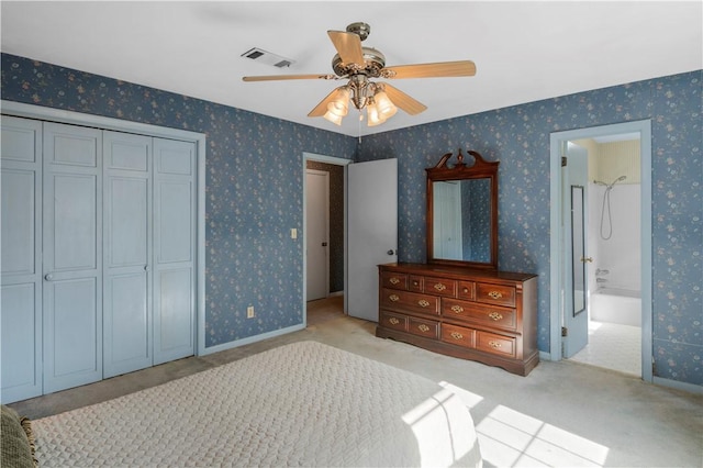 208 Plantation Dr, Waycross, GA 31501 - bedroom featuring carpet floors, a closet, wallpapered walls, and visible vents