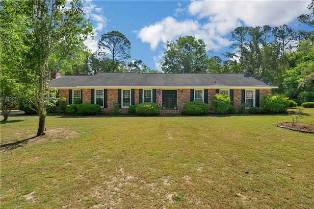 208 Plantation Dr, Waycross, GA 31501 - ranch-style house featuring brick siding, a chimney, and a front lawn