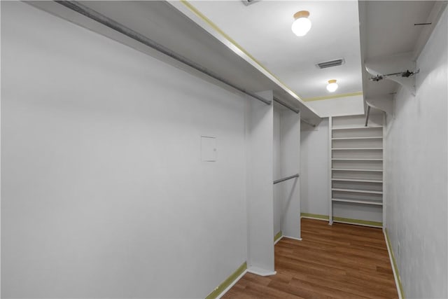 208 Plantation Dr, Waycross, GA 31501 - walk in closet with wood finished floors