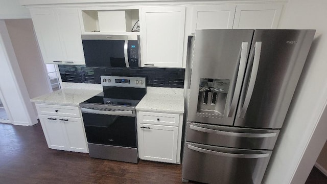 102 Norwood Ct, Brunswick, GA 31525 - kitchen with stainless steel appliances, backsplash, light stone countertops, and white cabinetry