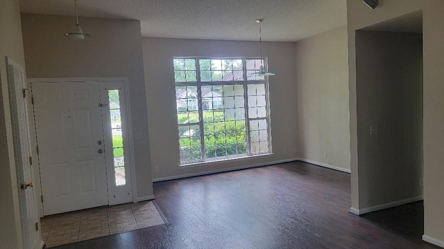 102 Norwood Ct, Brunswick, GA 31525 - entryway with wood finished floors, plenty of natural light, and a textured ceiling