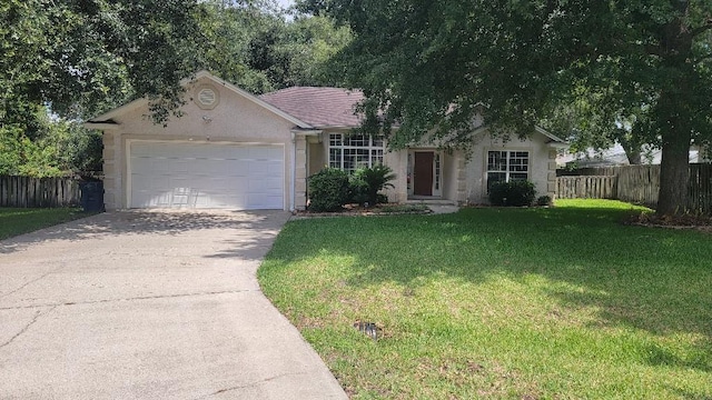102 Norwood Ct, Brunswick, GA 31525 - view of front of home featuring stucco siding, a garage, and concrete driveway