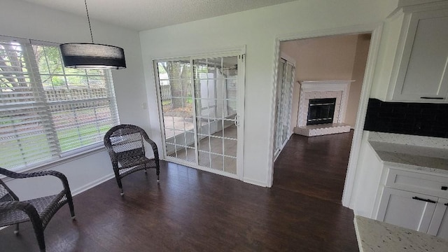 102 Norwood Ct, Brunswick, GA 31525 - dining space featuring dark wood-style flooring and a glass covered fireplace