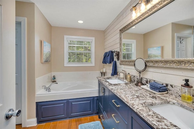 200 Colgana Way, Saint Simons Island, GA 31522 - full bath with wood finished floors, double vanity, and a garden tub