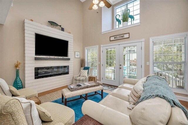 200 Colgana Way, Saint Simons Island, GA 31522 - living room with ceiling fan, wood finished floors, french doors, and a high ceiling