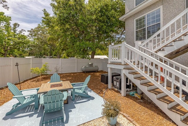 200 Colgana Way, Saint Simons Island, GA 31522 - fenced backyard with stairway, a patio, and outdoor dining space