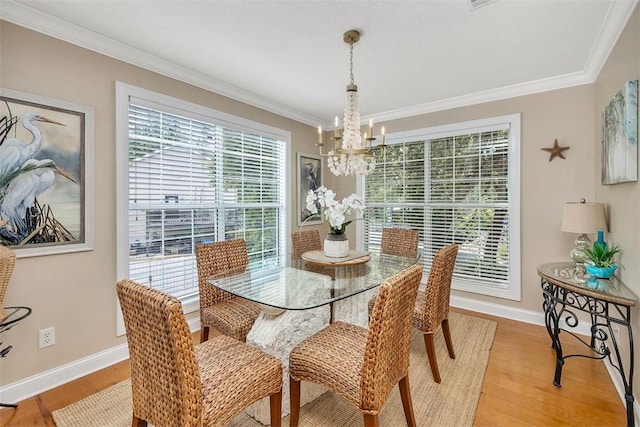 200 Colgana Way, Saint Simons Island, GA 31522 - dining area featuring a chandelier, ornamental molding, and wood finished floors