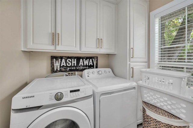200 Colgana Way, Saint Simons Island, GA 31522 - laundry room with washing machine and dryer and cabinet space