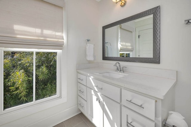 bathroom with vanity and tile patterned flooring