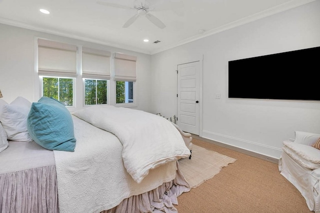 bedroom with hardwood / wood-style flooring, crown molding, and ceiling fan