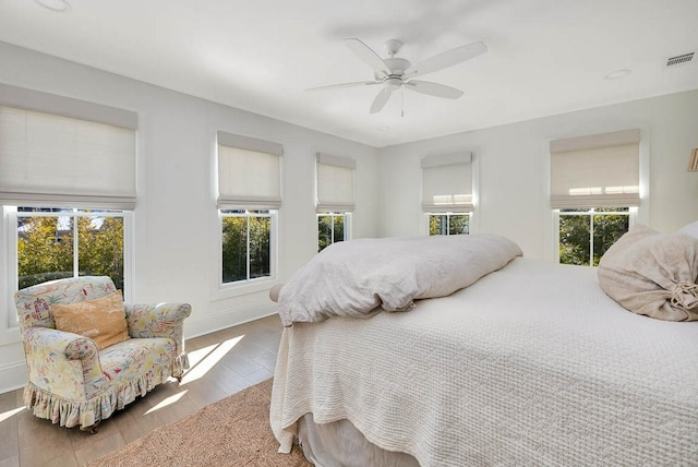 bedroom featuring hardwood / wood-style flooring and ceiling fan