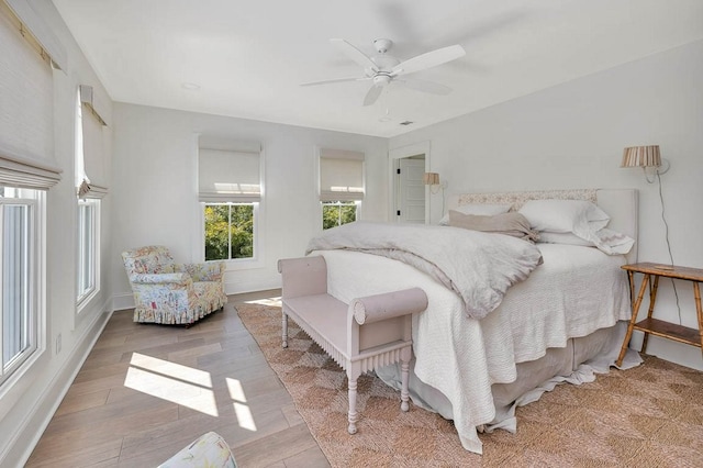 bedroom featuring ceiling fan and hardwood / wood-style floors