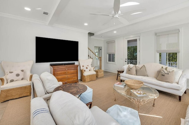 living room with beamed ceiling, ceiling fan, and crown molding