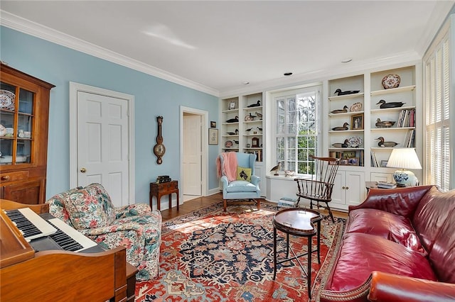 living room featuring crown molding, wood-type flooring, and built in features