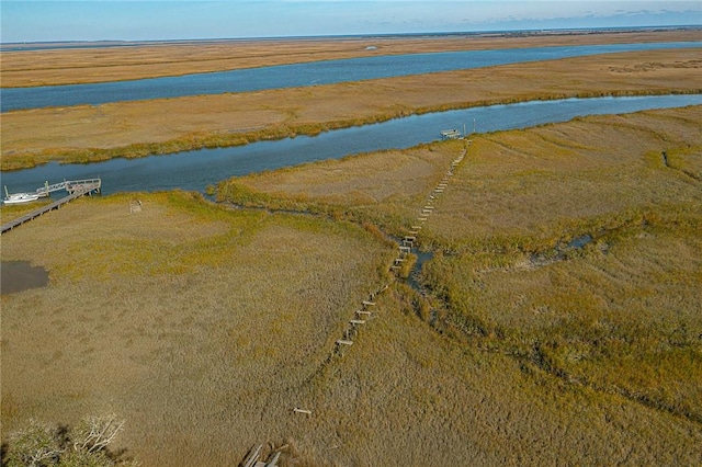 drone / aerial view with a water view and a rural view