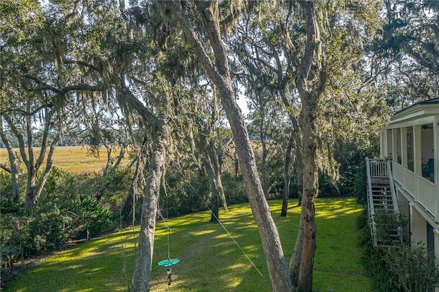 view of yard with a sunroom