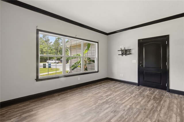 18 Ace Cir, Brunswick, GA 31523 - spare room with crown molding and wood finished floors