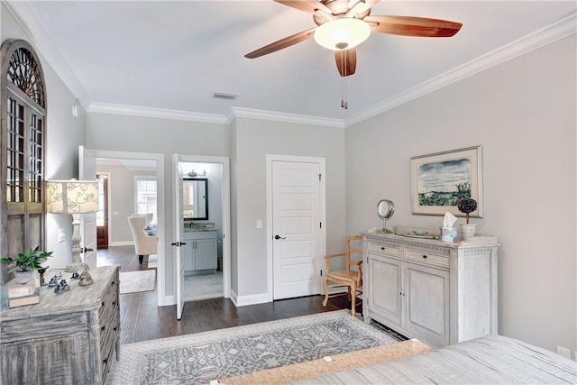 bedroom with ceiling fan, dark hardwood / wood-style floors, ornamental molding, and ensuite bath