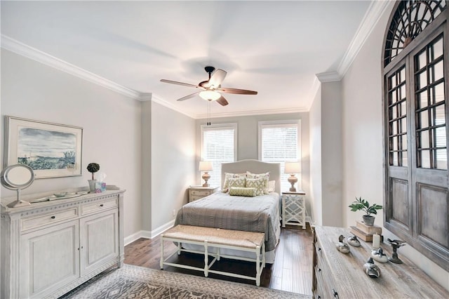 bedroom featuring ceiling fan, dark hardwood / wood-style floors, and ornamental molding