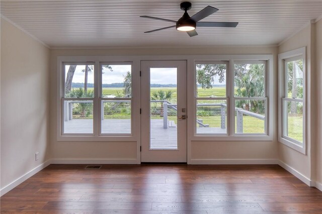 2593 Julienton Dr NE, Townsend, GA 31331 - doorway with plenty of natural light, baseboards, dark wood-style floors, a ceiling fan, and crown molding