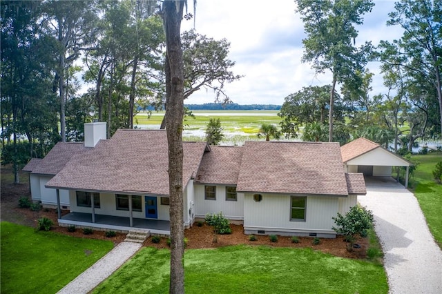 view of front of property with driveway, roof with shingles, crawl space, a front lawn, and a chimney