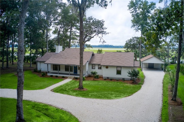 2593 Julienton Dr NE, Townsend, GA 31331 - ranch-style home featuring covered porch, an outbuilding, gravel driveway, and a front lawn