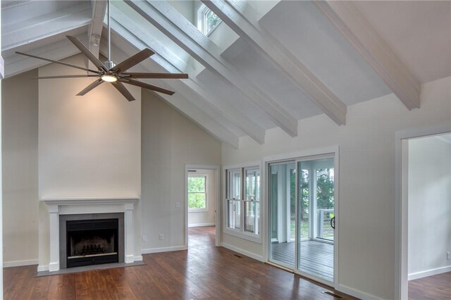 2593 Julienton Dr NE, Townsend, GA 31331 - unfurnished living room with beam ceiling, ceiling fan, high vaulted ceiling, a fireplace with flush hearth, and wood finished floors