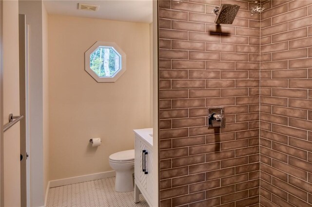 2593 Julienton Dr NE, Townsend, GA 31331 - bathroom with tiled shower, toilet, and vanity