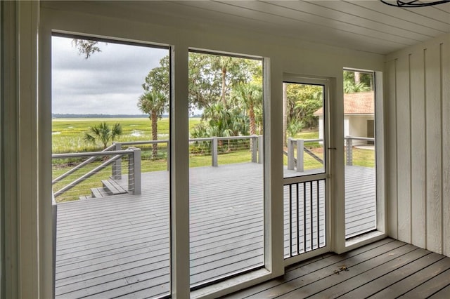 doorway to outside featuring hardwood / wood-style flooring and a rural view